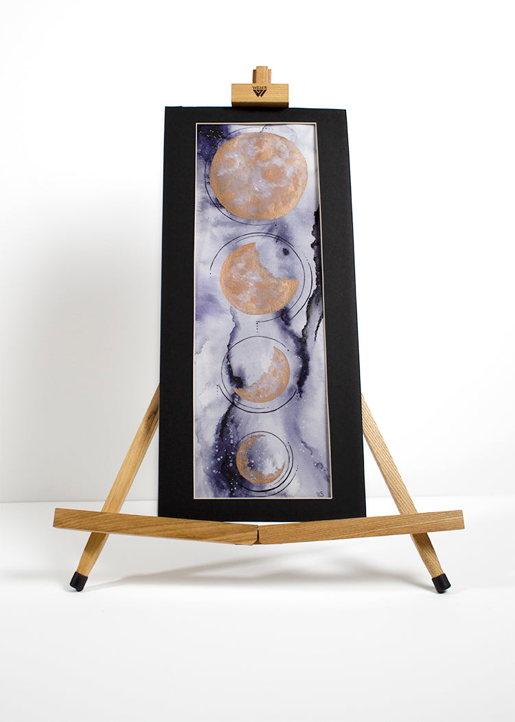 Blue-and-Bronze-Hanging-Moon-Phases-Painting-Easel