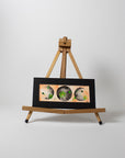 Orange-and-Green-Floral-Moon-Phases-Watercolor-Painting-Easel